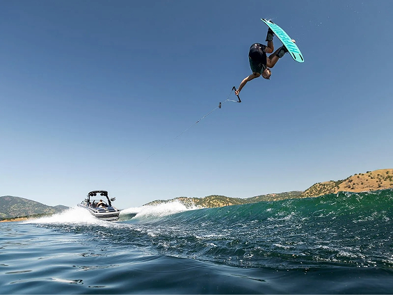 Wake surf boat with tower, racks and surf gear